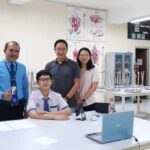 Kepala SMP Kristen Eben Haezar 1 Manado Hopny J. Ume, M.Pd (kiri) dan Axellion Tandani (duduk)Peraih Medali Perak OSN tkt Nasional Mata pelajaran Matematika.