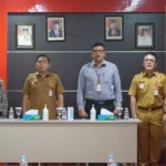 Kepala Badan Keuangan dan Aset Daerah (BKAD) Pemprov Sulut, Clay J. H. Dondokambey dan Pemimpin Cabang Utama Bank SulutGo, Mona Manoppo