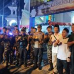 Gerakan Pemuda Ansor Kota Manado turut serta dalam melakukan pengamanan ibadah malam Natal di sejumlah gereja di Kota Manado, Minggu (24/12/2023).