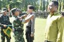 Panglima Kodam XIII/Merdeka Mayjen TNI Mirza Agus memimpin upacara penutupan TMMD ke-128 Tahun Anggaran 2026 di Lapangan Alun-Alun Desa Limbato, Kecamatan Tilamuta, Kabupaten Boalemo, Kamis (21/5/2026).